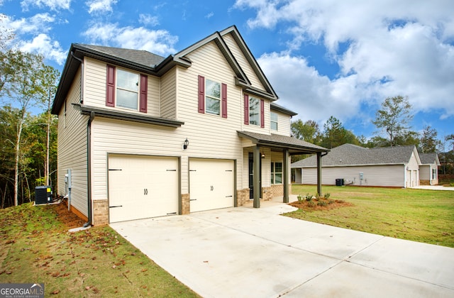 view of front of property featuring a front lawn, central AC unit, and a garage