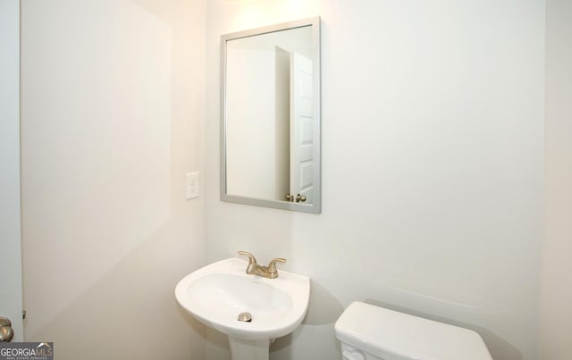 172 Chapman Rdg, Macon, GA 31211 - half bathroom with a sink and toilet