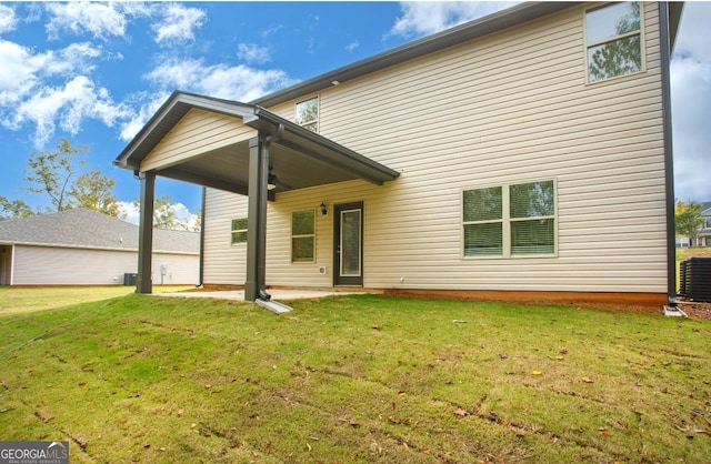 172 Chapman Rdg, Macon, GA 31211 - back of property featuring ceiling fan, a yard, and central air condition unit
