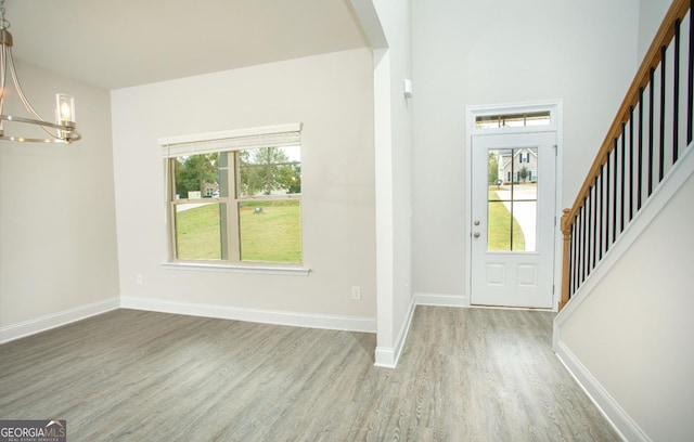 172 Chapman Rdg, Macon, GA 31211 - entrance foyer featuring a chandelier, wood finished floors, stairway, and baseboards