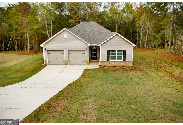 view of front of house featuring a front yard and a garage