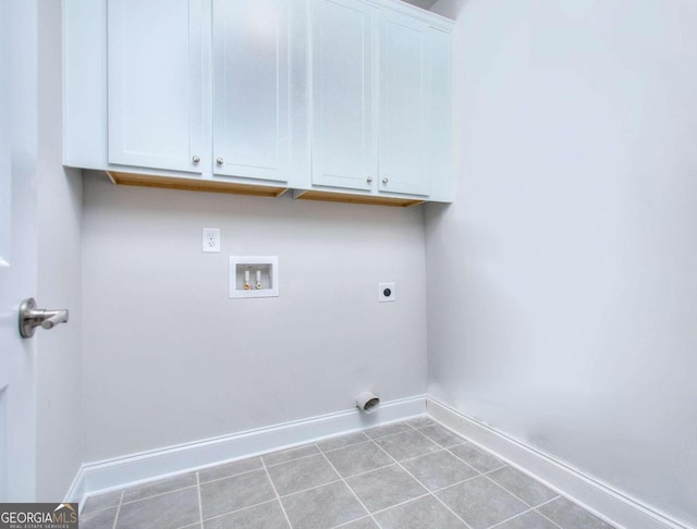 168 Chapman Ridge Rd, Macon, GA 31211 - washroom featuring cabinet space, electric dryer hookup, baseboards, hookup for a washing machine, and tile patterned flooring