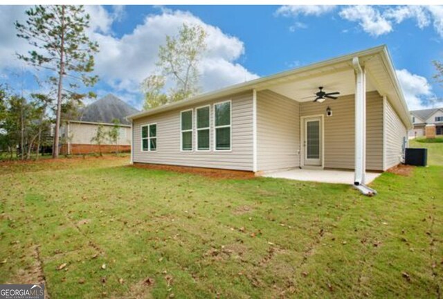 168 Chapman Ridge Rd, Macon, GA 31211 - back of property featuring ceiling fan, a patio, and a lawn