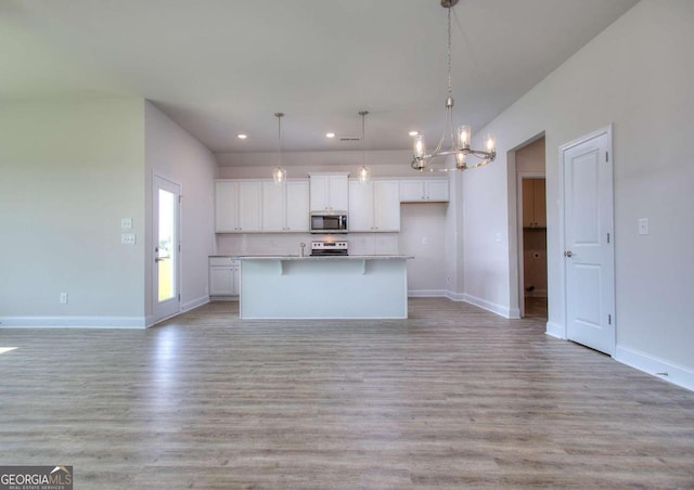 168 Chapman Ridge Rd, Macon, GA 31211 - kitchen with stainless steel appliances, a chandelier, recessed lighting, white cabinetry, and open floor plan