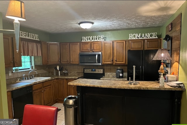 kitchen featuring backsplash, a textured ceiling, black appliances, and sink