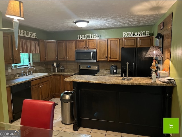 kitchen with black appliances, a textured ceiling, tasteful backsplash, sink, and light tile floors