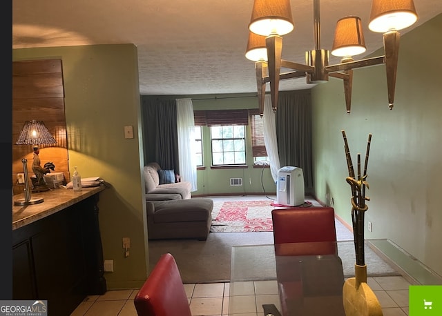 bedroom featuring a textured ceiling and tile floors