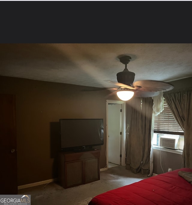 bedroom featuring light colored carpet and ceiling fan