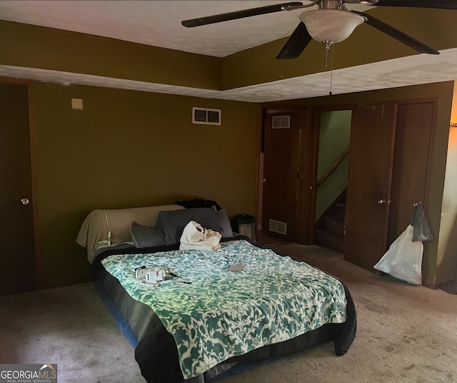 carpeted bedroom featuring ceiling fan