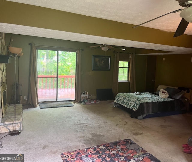 bedroom with access to outside, ceiling fan, carpet floors, and multiple windows