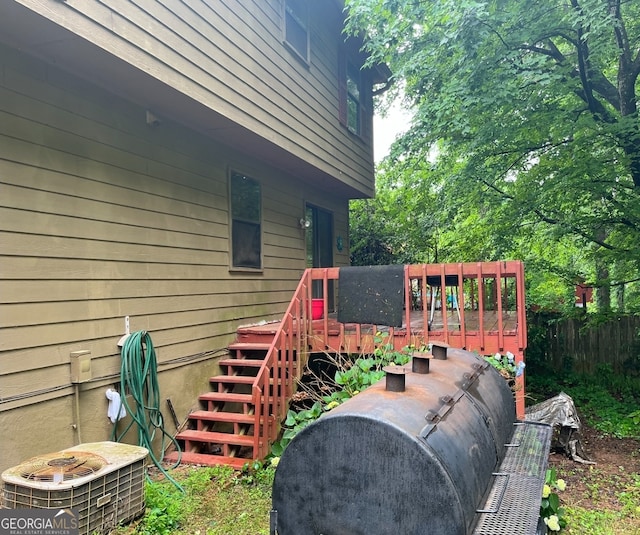 wooden deck featuring a lawn