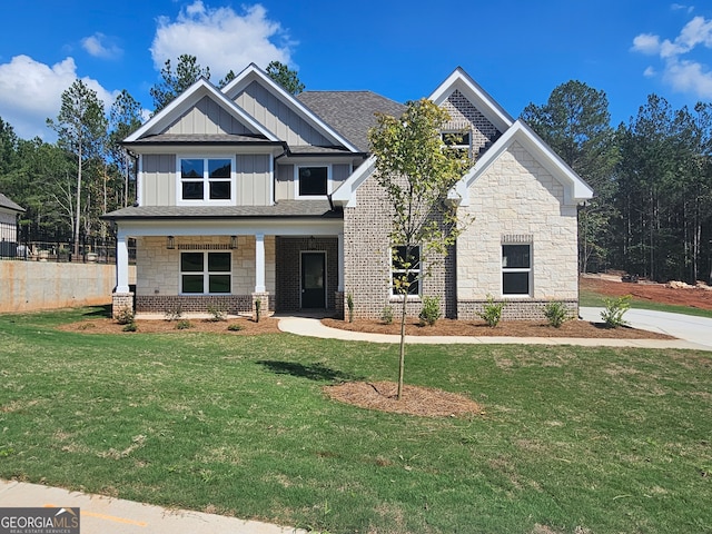 craftsman house with covered porch and a front lawn