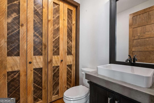 bathroom with vanity and toilet