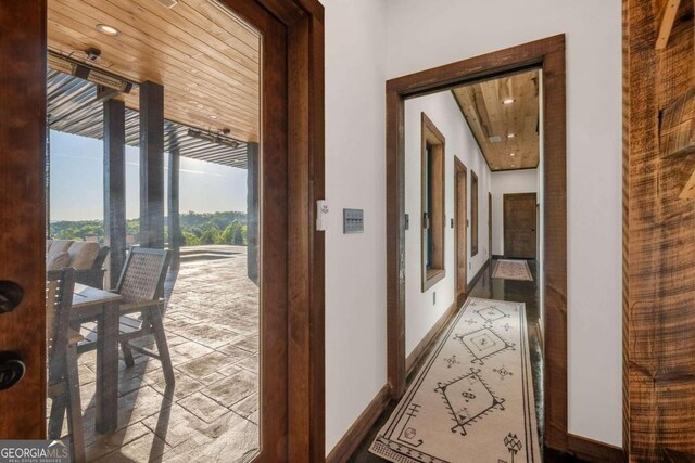 hallway featuring wood ceiling