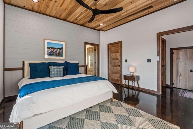 bedroom featuring ceiling fan and wooden ceiling