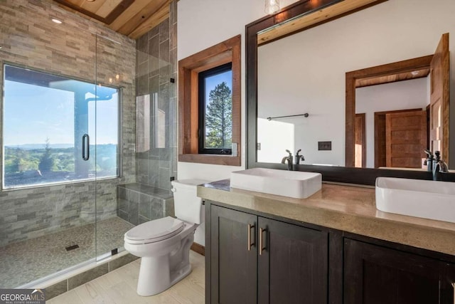 bathroom with walk in shower, toilet, tile floors, and vanity