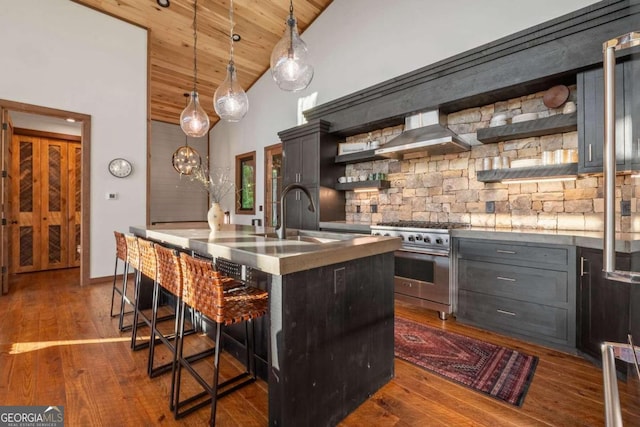 kitchen with hanging light fixtures, stainless steel range, wall chimney exhaust hood, wood ceiling, and dark hardwood / wood-style flooring