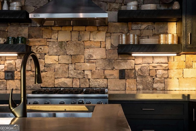 room details featuring wall chimney range hood