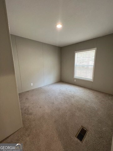 empty room featuring carpet floors