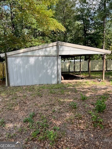 view of outdoor structure with a carport