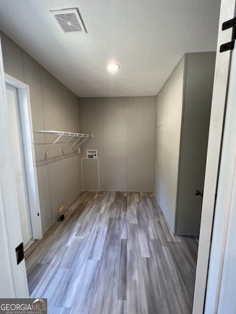 interior space featuring hardwood / wood-style flooring and washer hookup