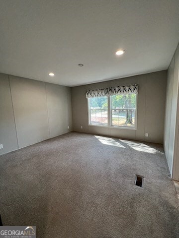 unfurnished room with carpet floors