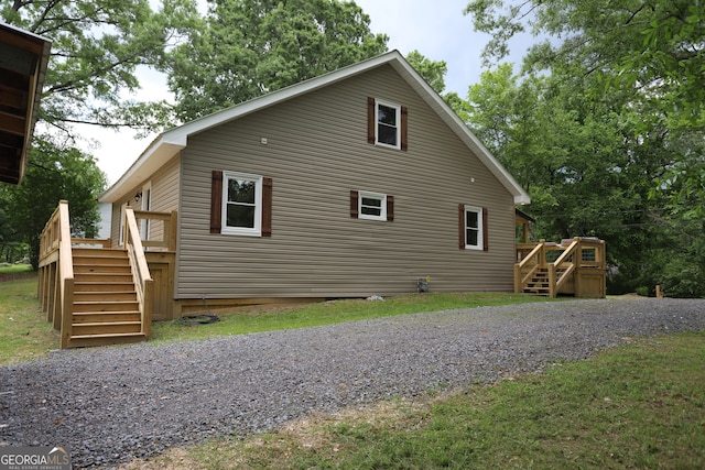 view of side of home with a deck