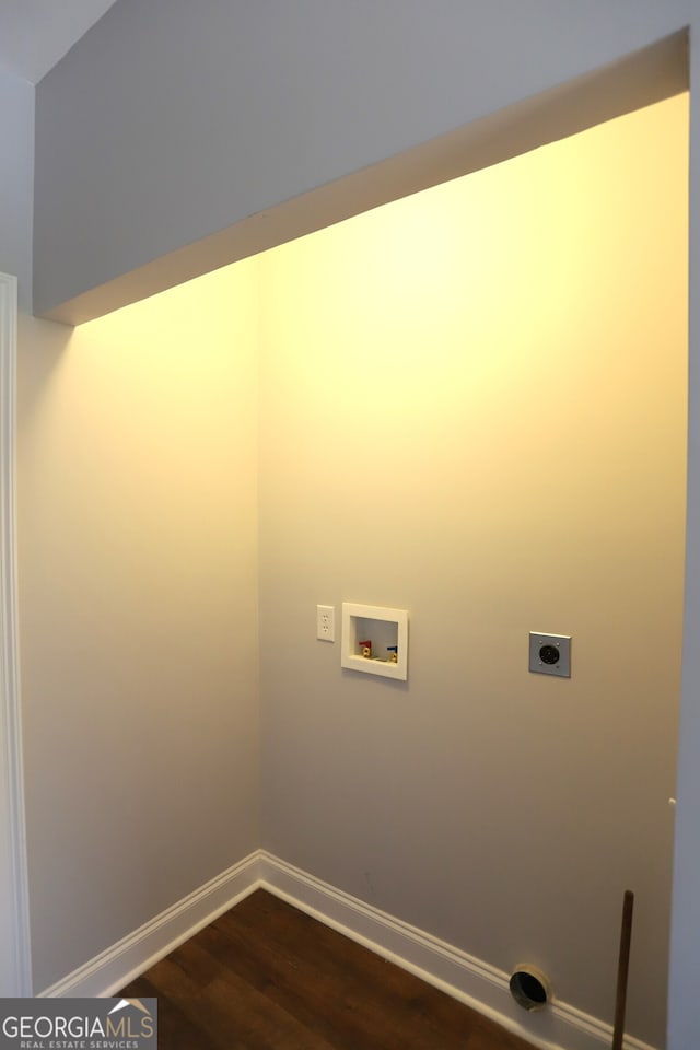 clothes washing area featuring hookup for a washing machine, hardwood / wood-style flooring, and electric dryer hookup