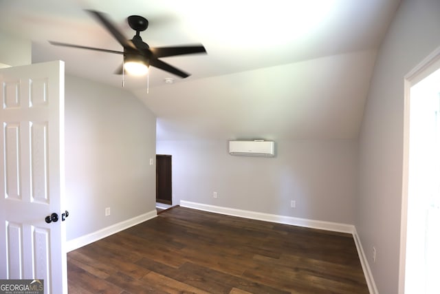 additional living space with dark wood-type flooring, lofted ceiling, an AC wall unit, and ceiling fan