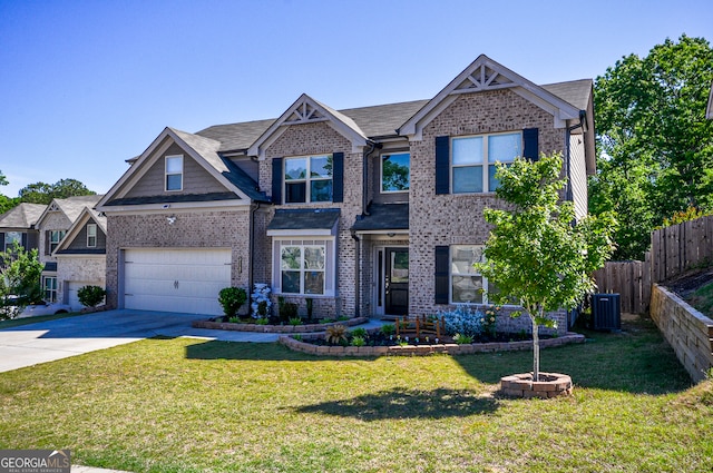 view of front of home with central air condition unit, a garage, and a front yard