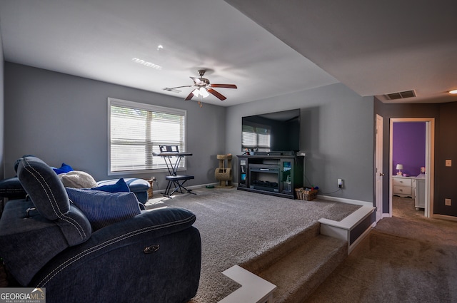 living room with carpet floors and ceiling fan