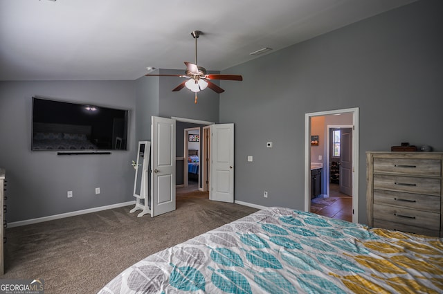 bedroom featuring carpet flooring, ensuite bath, ceiling fan, and lofted ceiling