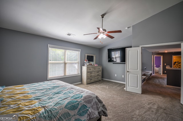 carpeted bedroom featuring vaulted ceiling and ceiling fan