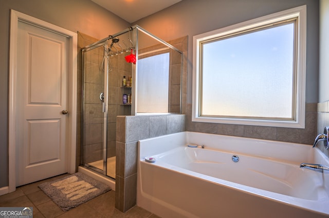 bathroom featuring tile flooring and independent shower and bath