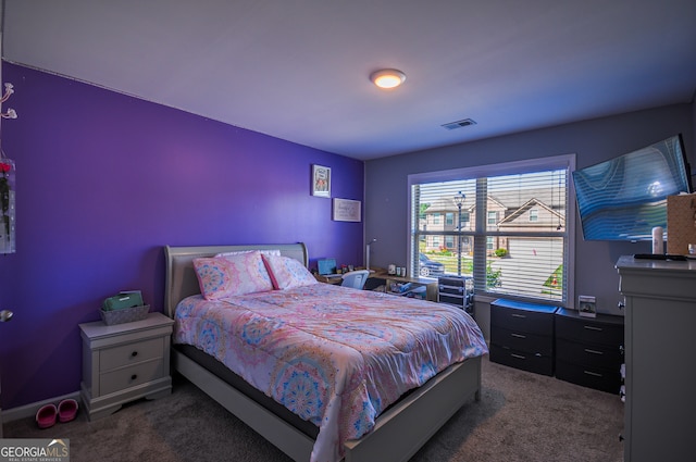 bedroom featuring dark colored carpet