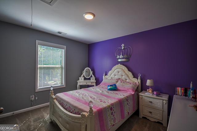 bedroom featuring dark colored carpet