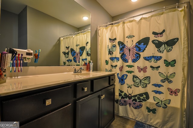 bathroom featuring tile flooring and vanity