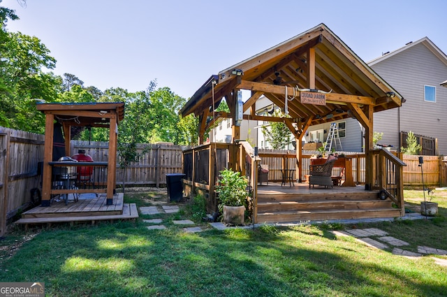 exterior space featuring a wooden deck and a gazebo