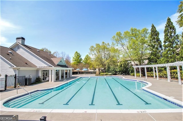 view of pool featuring a patio area and a pergola