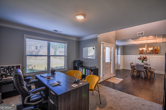 office space with ornamental molding, plenty of natural light, dark wood-type flooring, and a notable chandelier