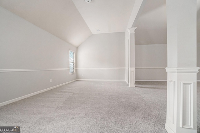 additional living space with carpet flooring and lofted ceiling