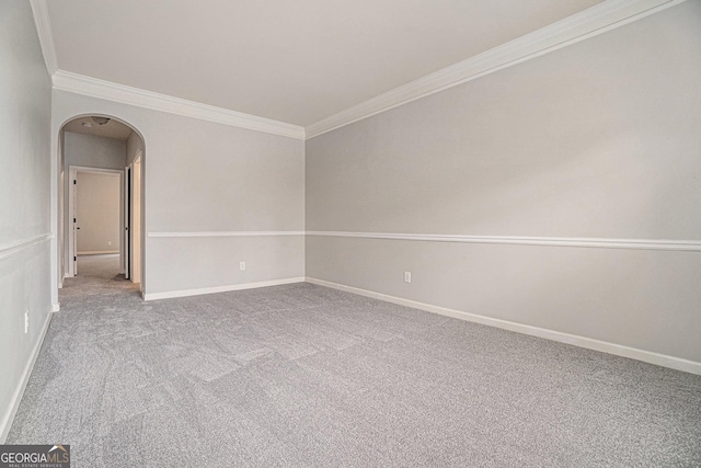 unfurnished room featuring carpet floors and ornamental molding