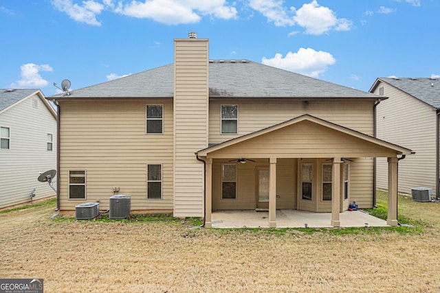 rear view of property with central air condition unit, ceiling fan, and a patio