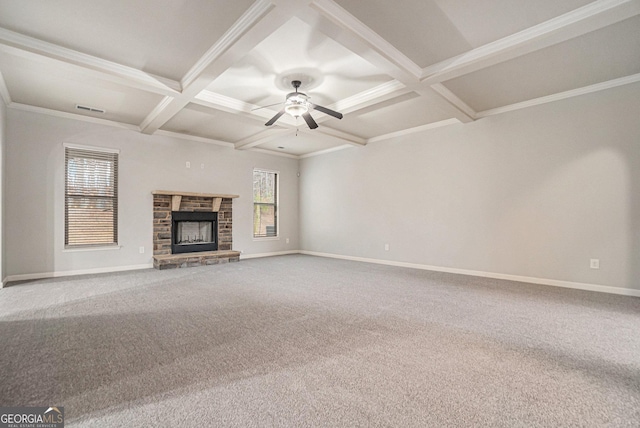 unfurnished living room with beam ceiling, carpet flooring, ceiling fan, coffered ceiling, and a fireplace