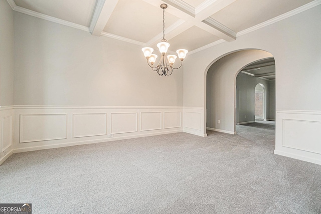 empty room featuring coffered ceiling, beamed ceiling, a notable chandelier, light colored carpet, and ornamental molding