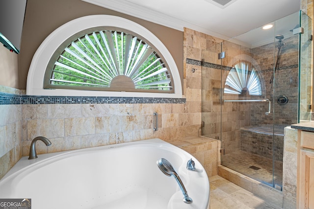 bathroom featuring a healthy amount of sunlight, crown molding, tile flooring, and separate shower and tub