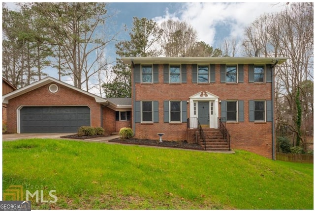 view of front of house featuring a garage and a front lawn