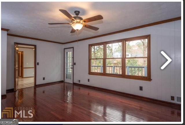 spare room featuring hardwood / wood-style floors, ceiling fan, and ornamental molding