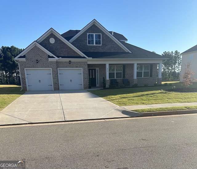 craftsman-style house with a front yard and a garage