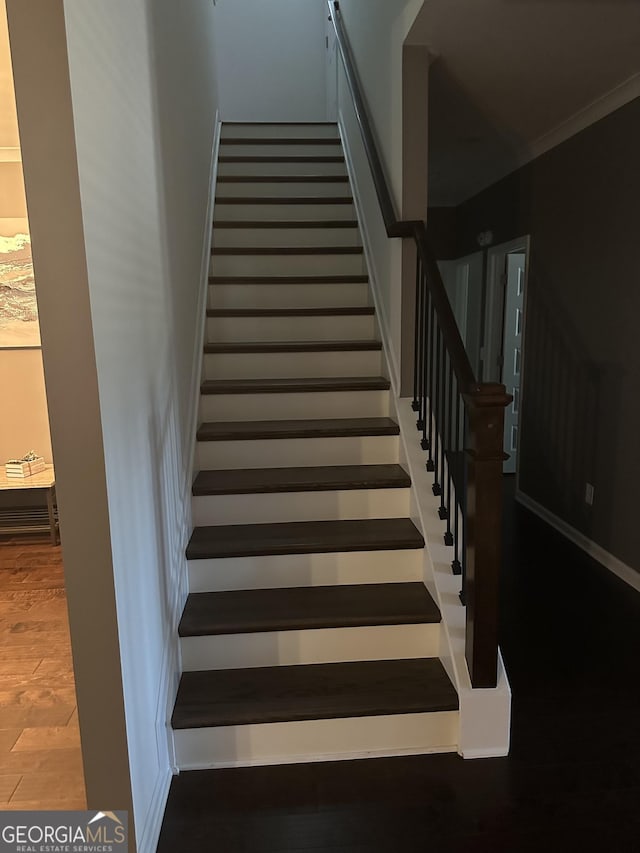 stairs with crown molding